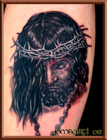 A very elegant tattoo design showing Jesus Christ on the arm. jesus tattoo