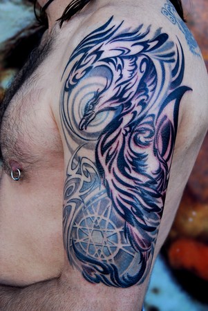 Comments: Half sleeve black and gray tattoo. Symbol of rebirth, enlightment 