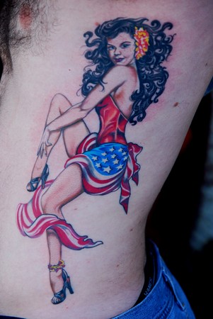  ribs tattoo, of new traditional pin up girl on Florida's Firefighter.